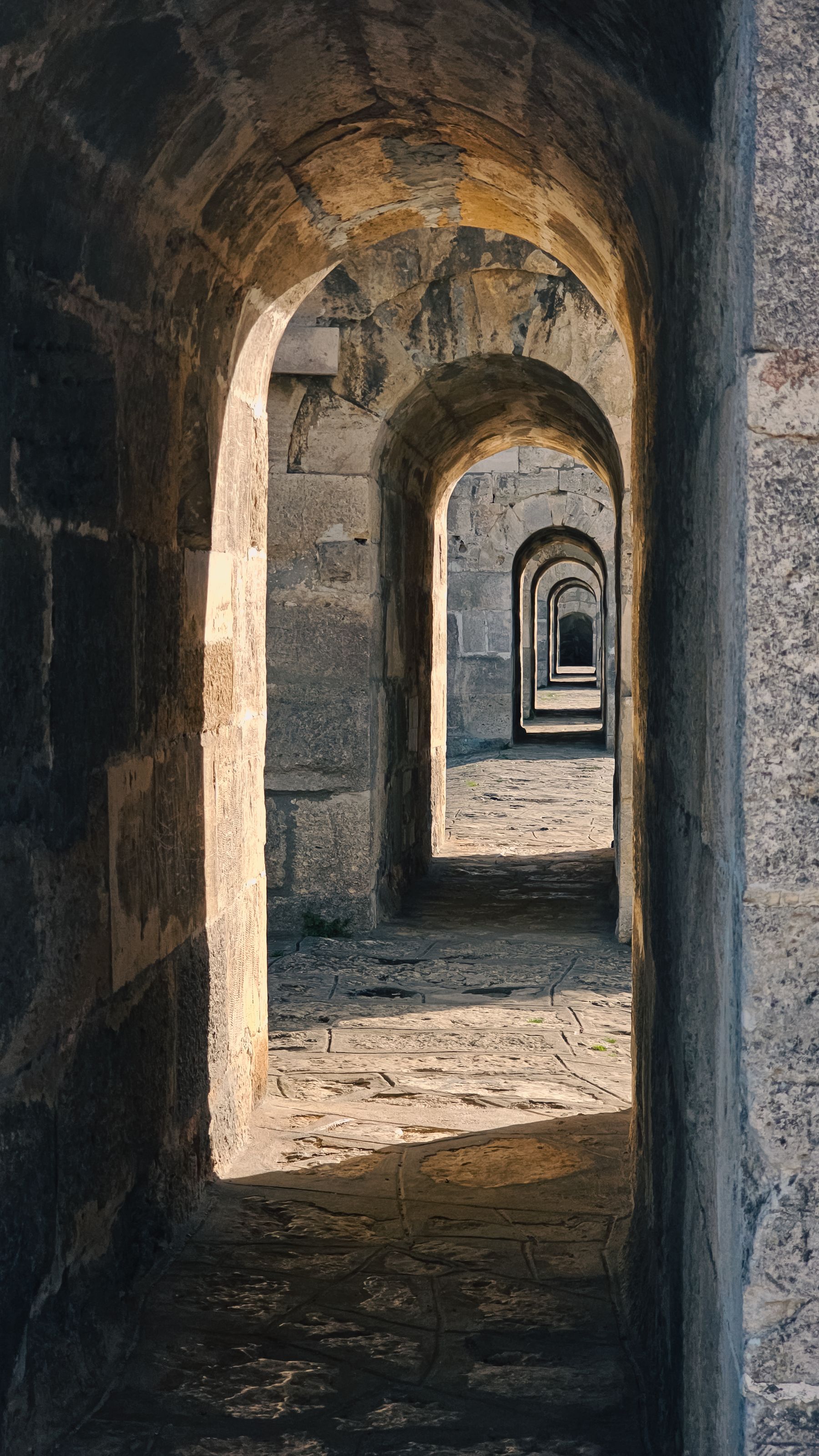 A sunlit stone archway — a threshold